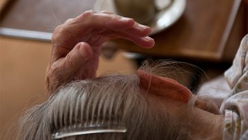 Lady-laying-down-in-care-home
