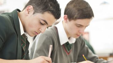 Two-male-pupils-in-a-lesson-at-a-Catholic-school