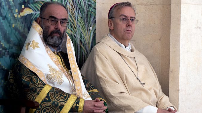 Bishop Hudson preaches on the banks of the River Jordan where Jesus was Baptised