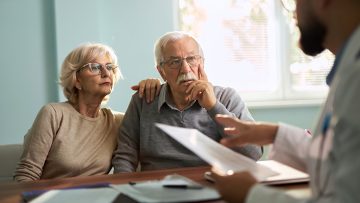 Senior couple  having a consultation with a doctor in the office